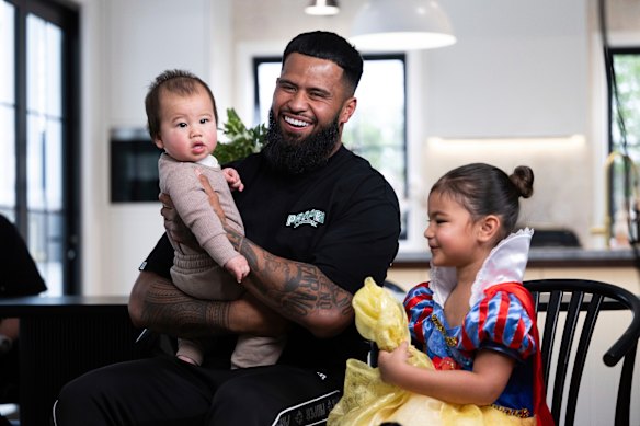 Payne Haas at his home with his daughter Lalita and son Luckee in Brisbane last year.