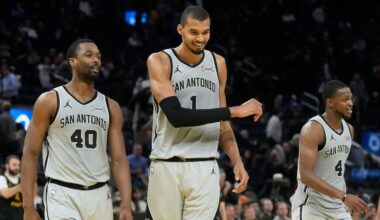 San Antonio Spurs forward Harrison Barnes (40) celebrates with center Victor Wembanyama (1) and guard De'aaron Fox (4) during the second half of an NBA basketball game against the Golden State Warriors in San Francisco, Wednesday, Feb. 11, 2026. (AP Photo/Jeff Chiu)