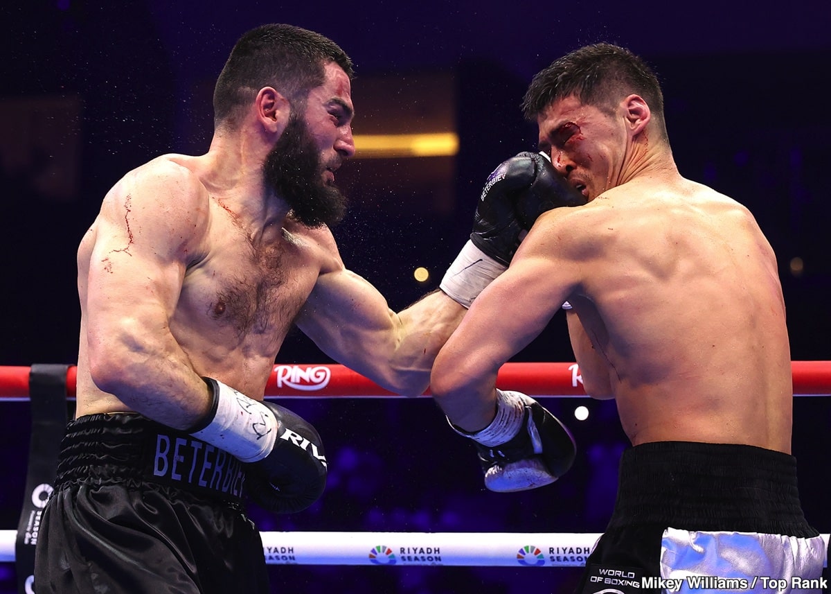 Artur Beterbiev lands a left hand on Dmitry Bivol during their light heavyweight rematch at the ANB Arena in Riyadh, Saudi Arabia, on February 22, 2025.