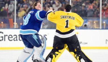 Tampa Bay Lightning goaltender Andrei Vasilevskiy (88) and Boston Bruins goaltender Jeremy Swayman (1) fight during the second period of a Stadium Series NHL hockey game Sunday, Feb. 1, 2026, in Tampa, Fla.