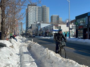 Bike lanes running along Bloor St. remain blocked with snow on Sunday, Feb. 1, 2026, in Toronto.
