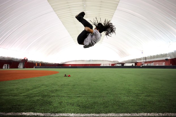 Corey Bell practices his standing backflip during the first team practice for the new Chicago Snowballs baseball team on Feb. 17, 2026, at The Dome at the Parkway Bank Sports Complex in Rosemont. (Chris Sweda/Chicago Tribune)