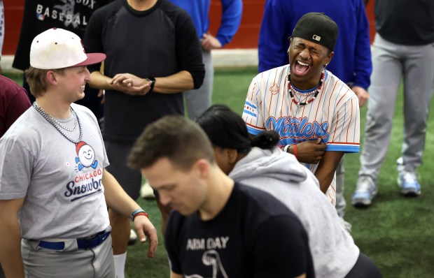 KG Gaiter laughs as players learn a dance routine during the first team practice for the Chicago Snowballs baseball team on Feb. 17, 2026, at The Dome at the Parkway Bank Sports Complex in Rosemont. (Chris Sweda/Chicago Tribune)