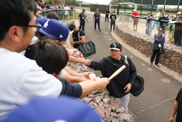 White Sox infielder Munetaka Murakami signs autographs for fans during spring training at Camelback Ranch on Monday, Feb. 16, 2026, in Glendale, Ariz. (Eileen T. Meslar/Chicago Tribune)
