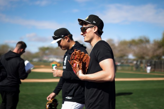 Chicago White Sox shortstop Colson Montgomery, right, walks onto the field with infielder Munetaka Murakami to do conditioning during spring training at Camelback Ranch in Glendale, Ariz., on Tuesday, Feb. 17, 2026. (Eileen T. Meslar/Chicago Tribune)