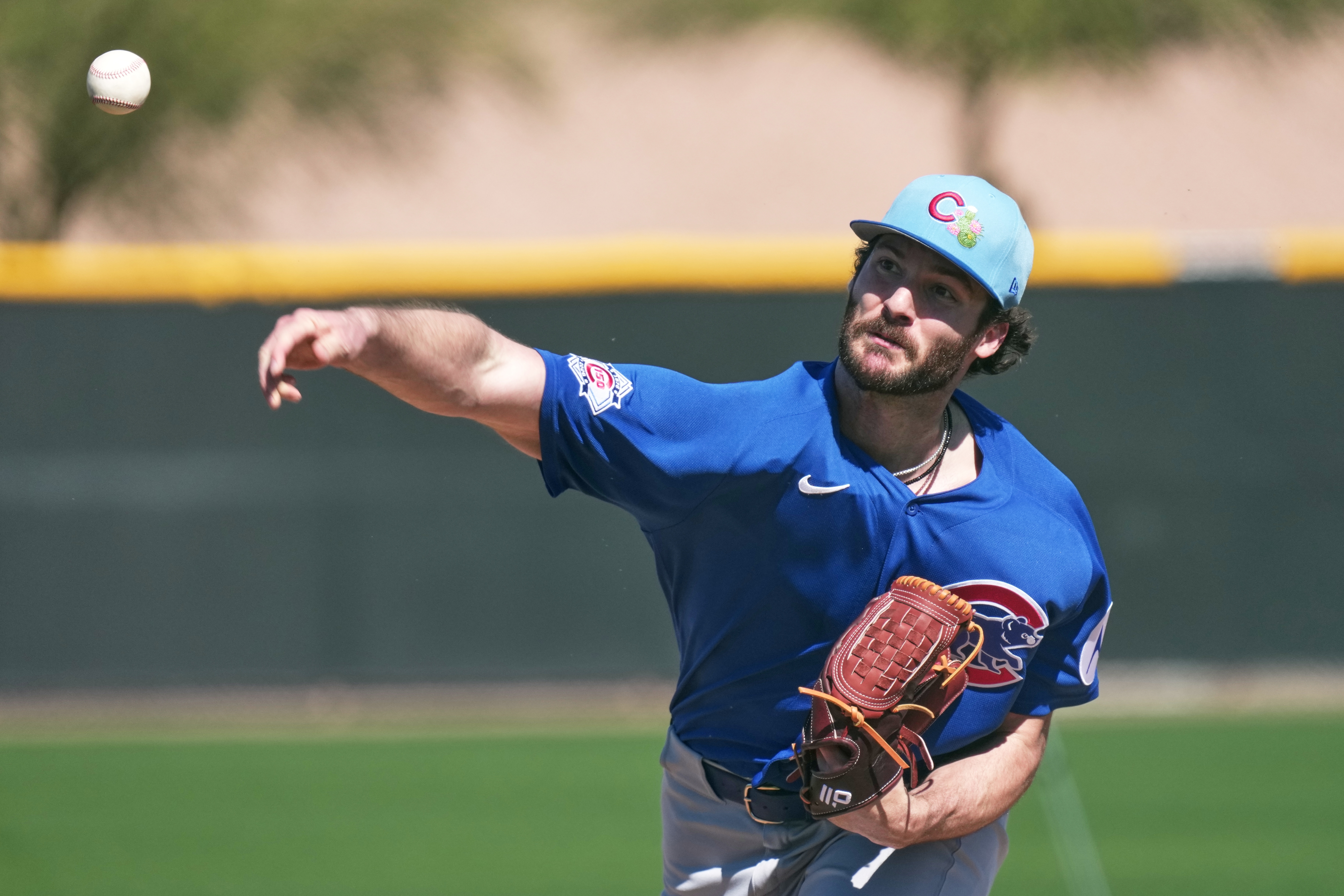 Cubs reliever Jack Neely throws during a spring training workout...