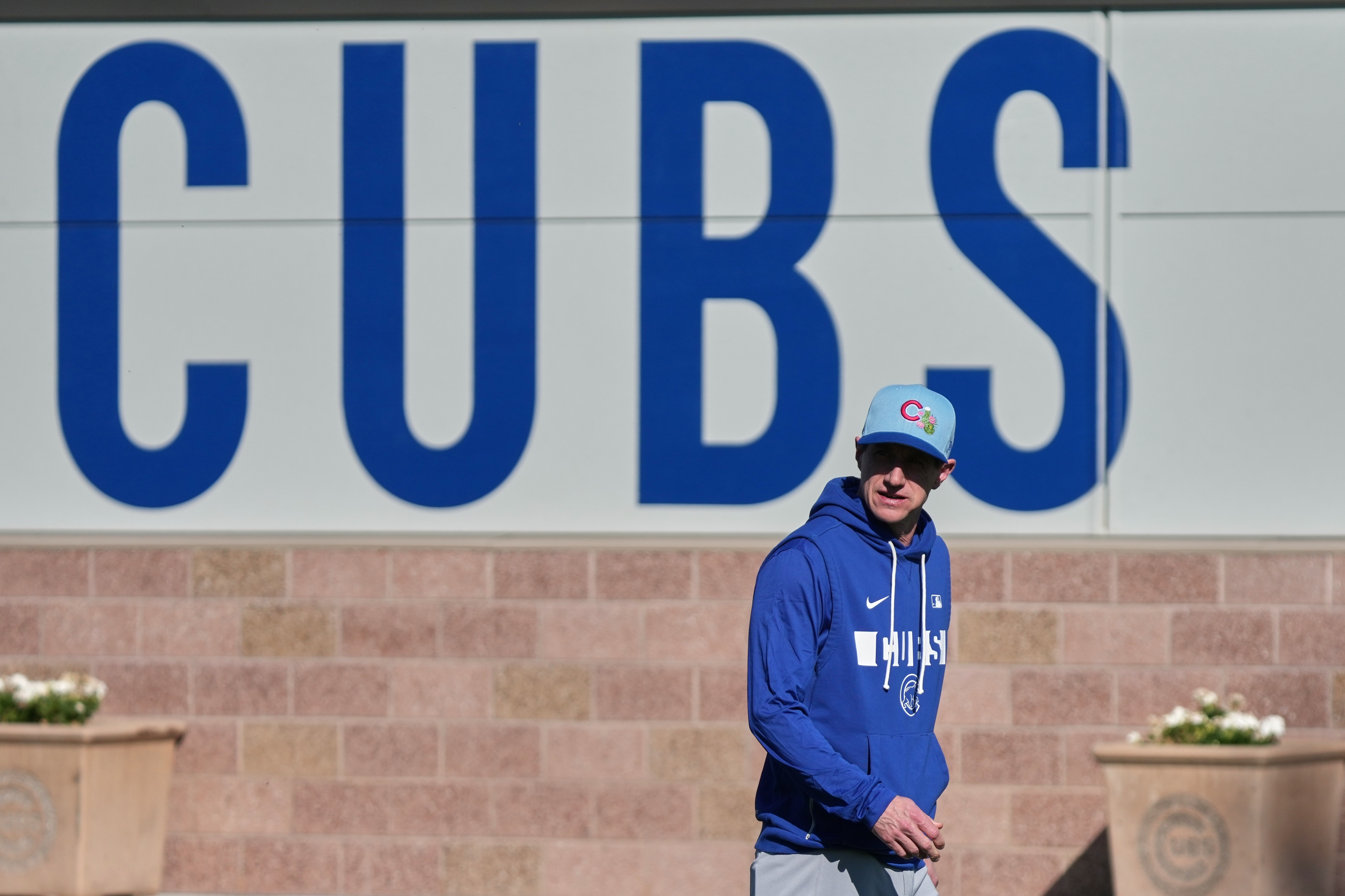 Cubs manager Craig Counsell observes during a spring training baseball...