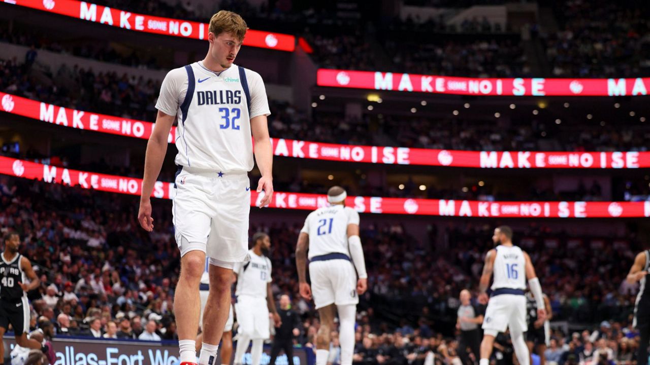 Dallas Mavericks forward Cooper Flagg (32) prepares to defend in the second half of an NBA basketball game against the San Antonio Spurs Thursday, Feb. 5, 2026, in Dallas. (AP Photo/Gareth Patterson)