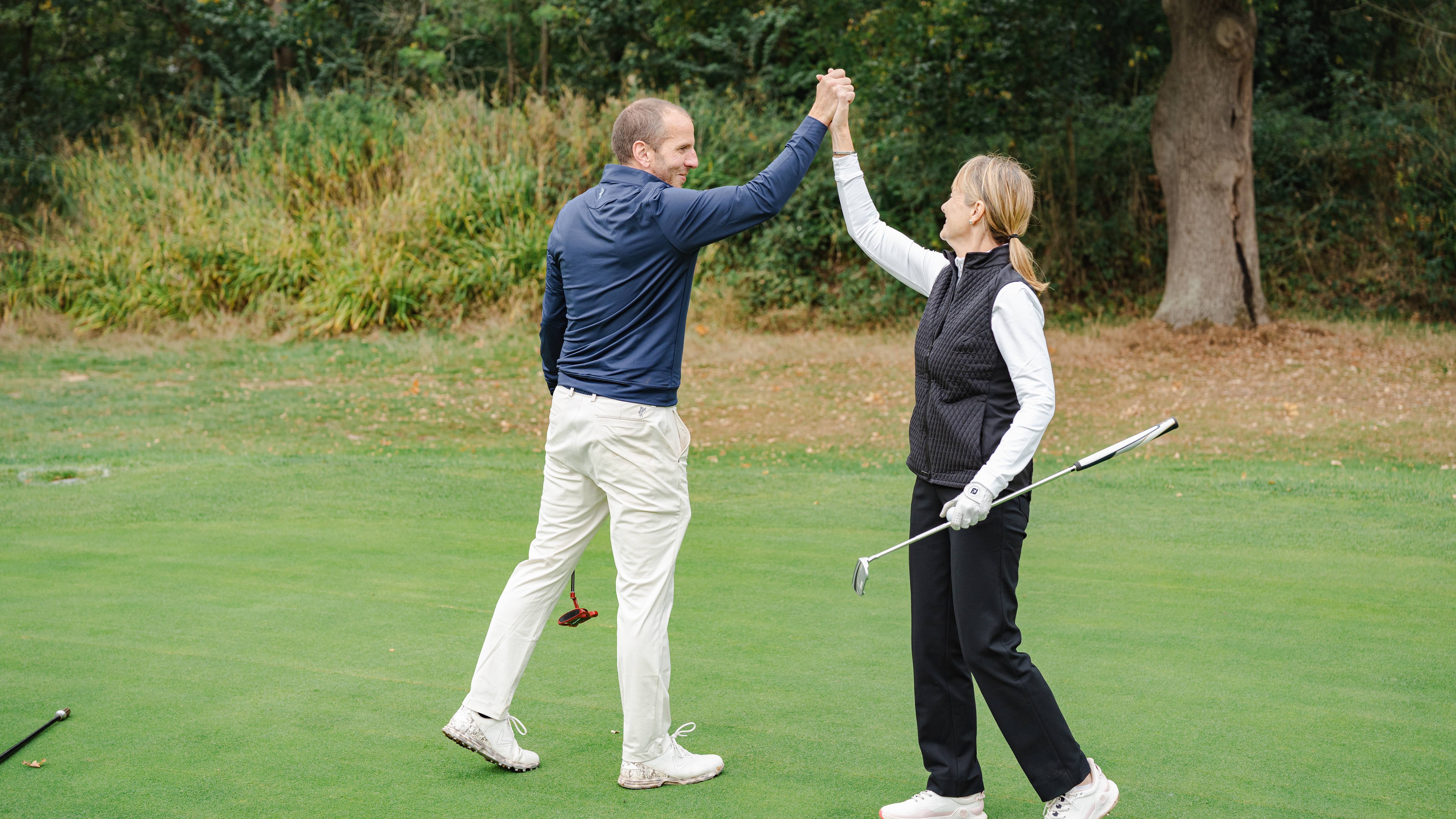 Alison Root and David Taylor high fiving
