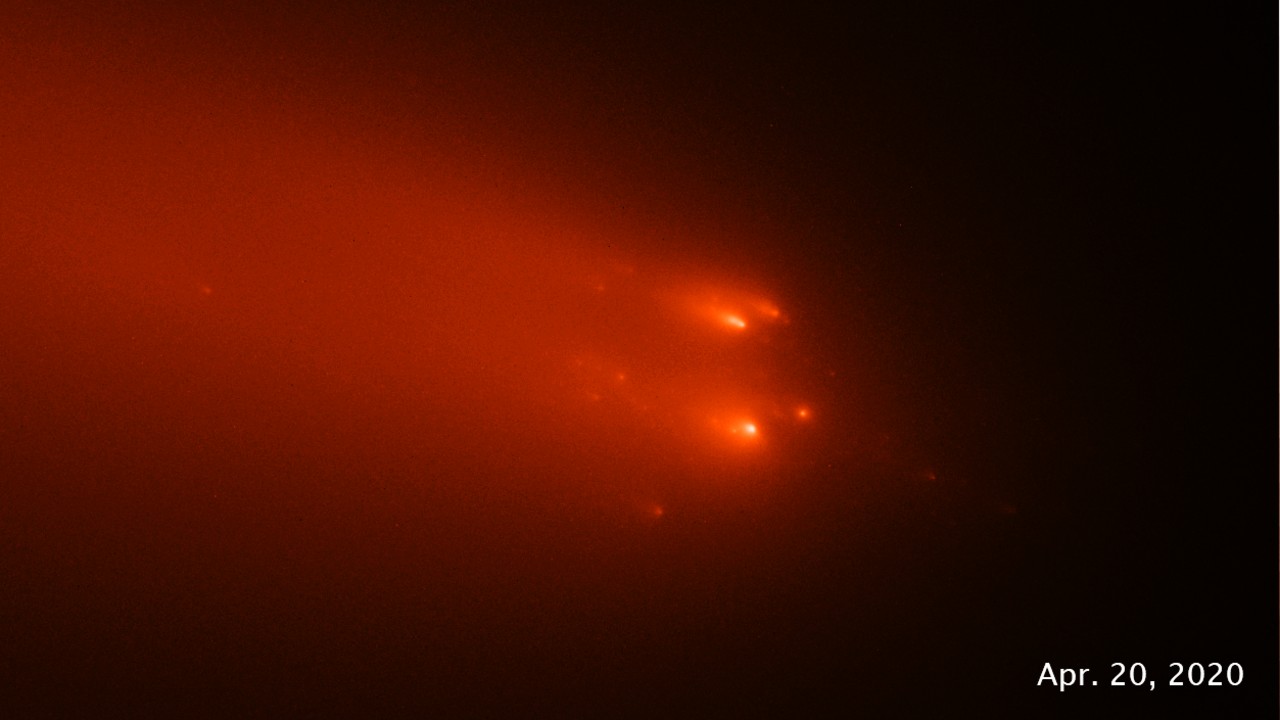 scattered red-orange dots of light on a black background