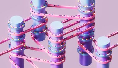 A series of purple vertical cylinders wrapped with pink and blue bands with various colored balls moving across them