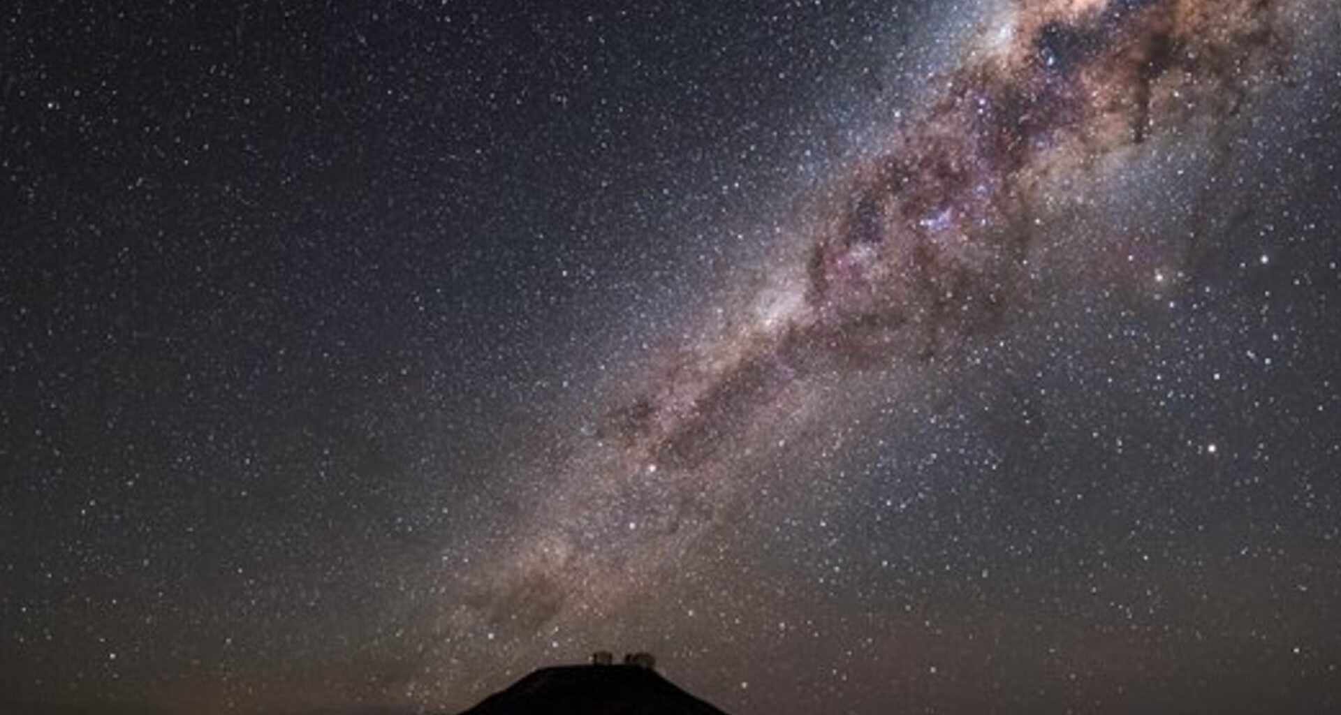 An image of the star-studded sky above the European Southern Observatory's (ESO) Paranal site dominated by the distinct band of the Milky Way galaxy.