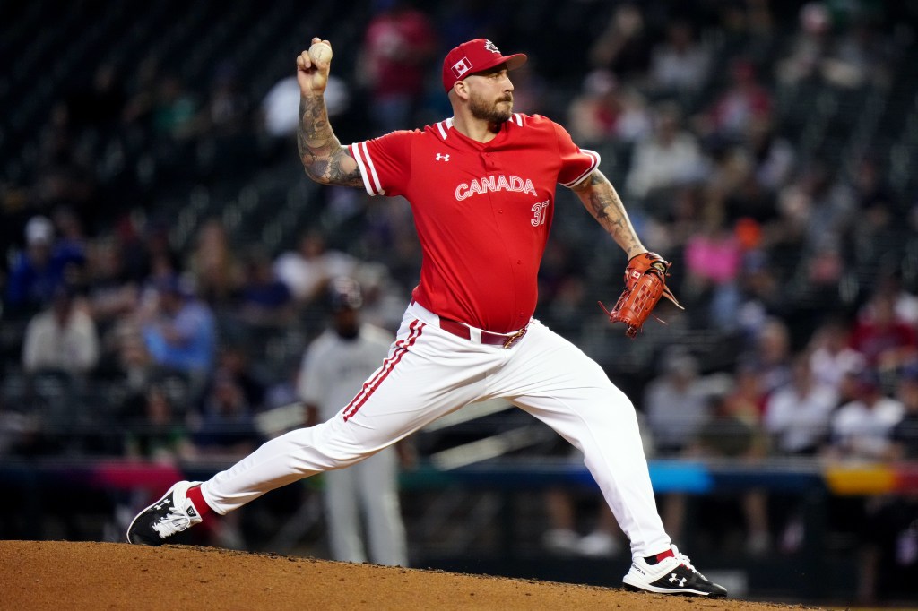 Phillippe Aumont #37 of Team Canada pitches during Game 3 of Pool C between Team Great Britain and Team Canada at Chase Field on Sunday, March 12, 2023 in Phoenix, Arizona. 