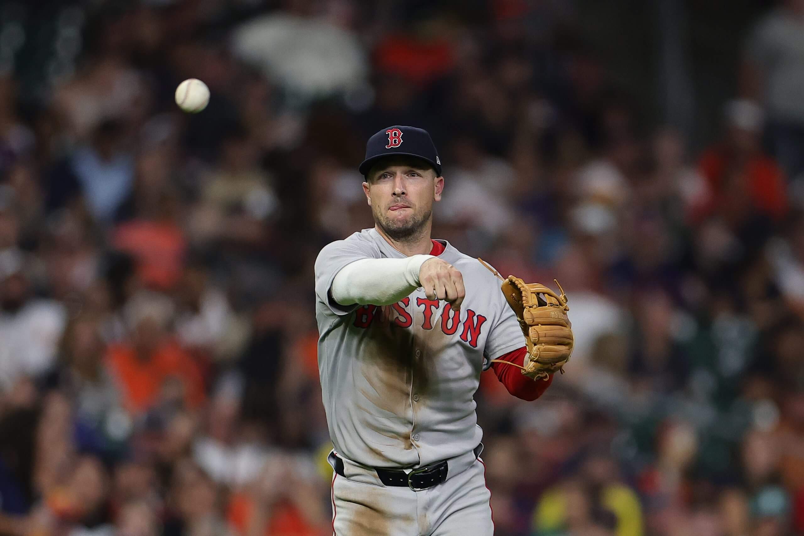 Close-up of pitcher Alex Bregman releasing the ball with his right hand and wearing a glove on his left.