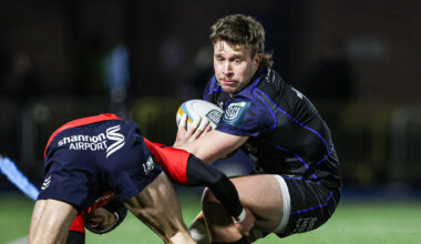 Glasgow Warriors' Kyle Rowe evades a tackle during the January URC match against Munster.