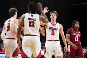 OXFORD, OHIO - JANUARY 27: Antwone Woolfolk #13 and Peter Suder #5 of the Miami (OH) RedHawks celebrate in the second half against the UMass Minutemen at Millett Hall on January 27, 2026 in Oxford, Ohio. (Photo by Dylan Buell/Getty Images)