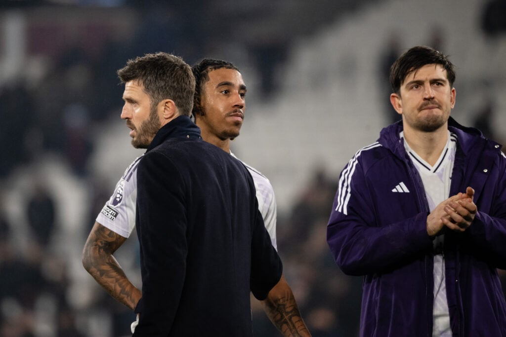 Michael Carrick reacts to Leny Yoro at the end of the Premier League match between West Ham United and Manchester United at the London Stadium in 2026 in London, England.