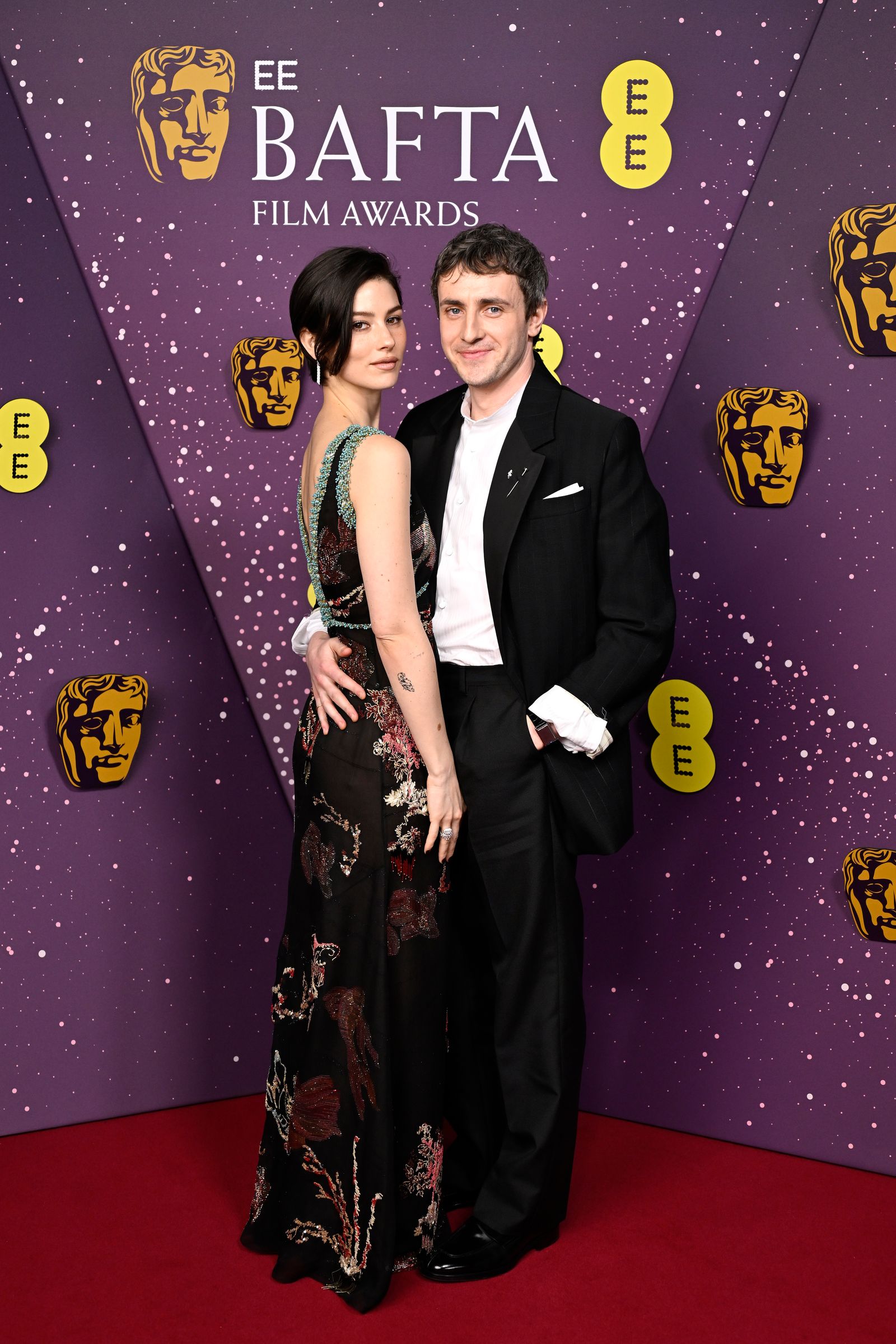 Image may contain Fashion Adult Person Face Head Premiere Clothing Formal Wear and Suit