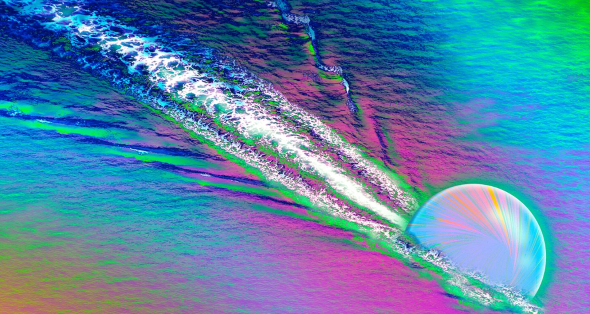 A colorful image shows a opalescent sphere carving a streak through a rainbow colored surface, kicking up white streaks behind it
