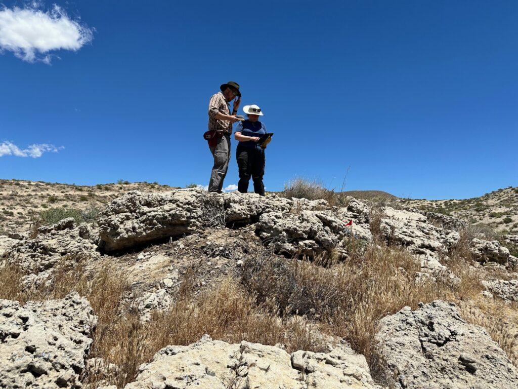 Slippery Rock University paleontologist Fabian Hardy and Anne Kort, assistant professor in the U-M Department of Earth and Environmental Sciences, discuss data and plan their next move at the field site of Red Rock Canyon State Park. Image credit: Brianne Catlin