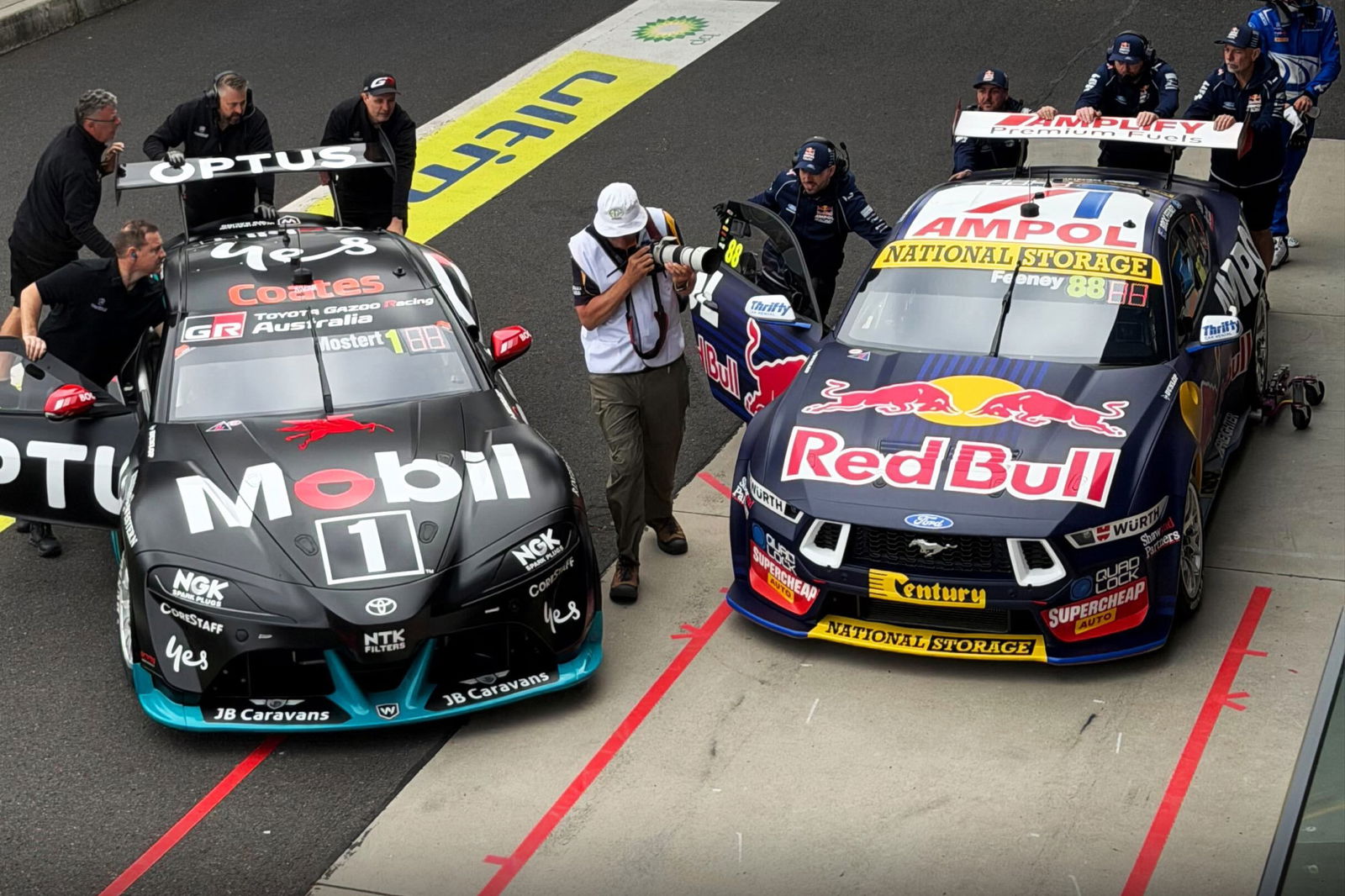 The #1 Optus Racing Toyota Supra and #88 Red Bull Ampol Racing Ford Mustang at Mount Panorama during the Bathurst 12 Hour.