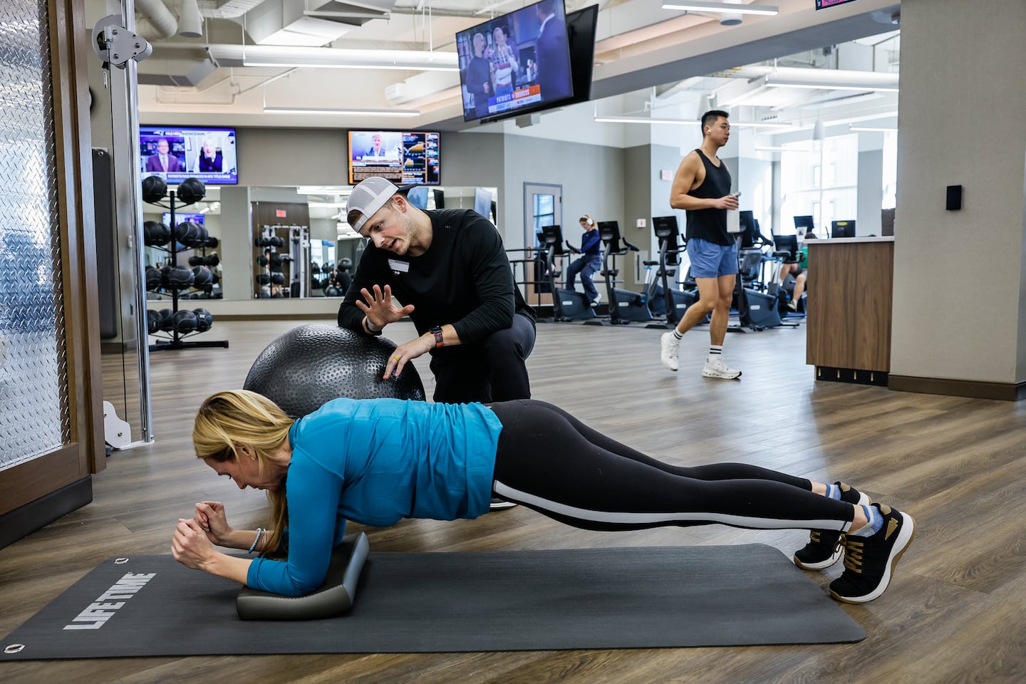 Personal trainer Zack Niziolek coached Jessica Good during a training session at the Life Time fitness club, on Jan. 23.
