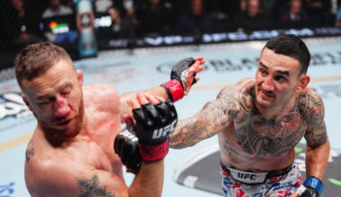 Justin Gaethje punched by Max Holloway at UFC 300