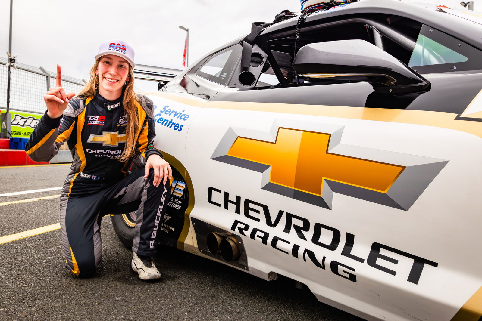 Alice Buckley celebrates winning Race 3 of the TA2 Muscle Car Series at Queensland Raceway. Image: Matthew Christie
