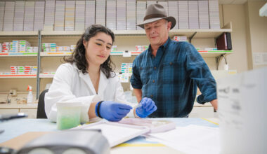 Sarah De Santos and Professor Michael Skinner work together in the laboratory.