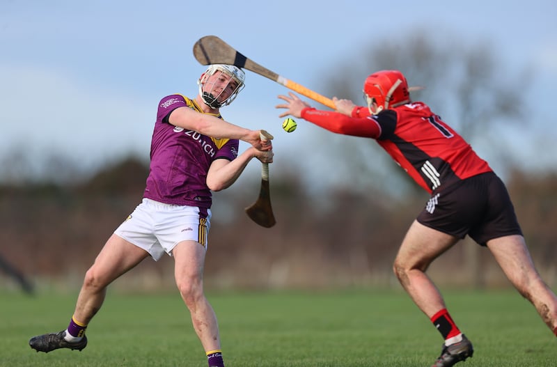 Down’s Pearse Óg McCrickard attempts a block on Wexford's Jack Redmond. Photograph: Leah Scholes/Inpho
