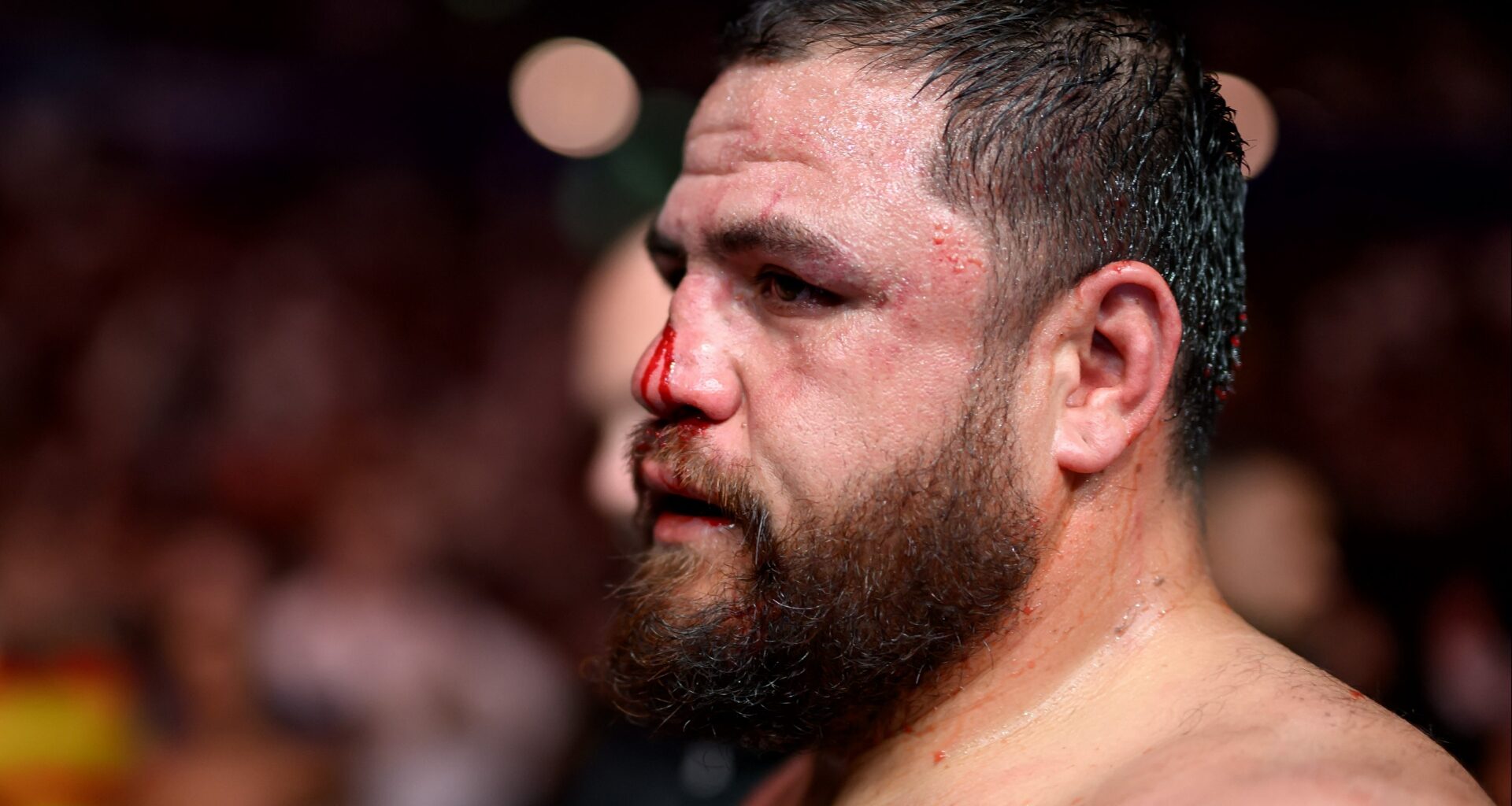 Tai Tuivasa departs the Octagon after a loss at UFC 325