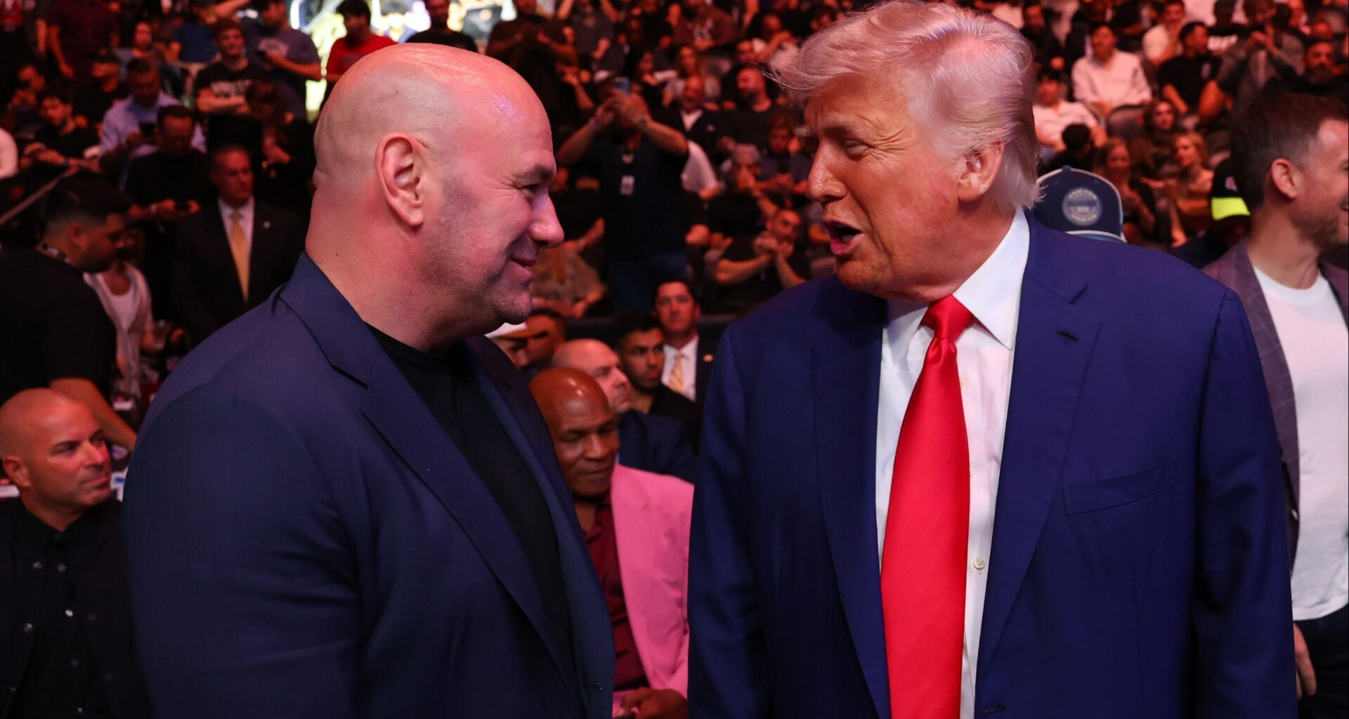 Dana White and Donald Trump speaking cageside at UFC 316