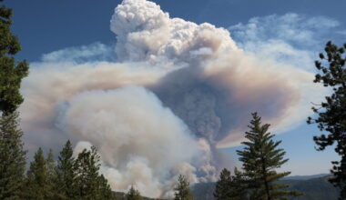 A large cloud of smoke in the sky.