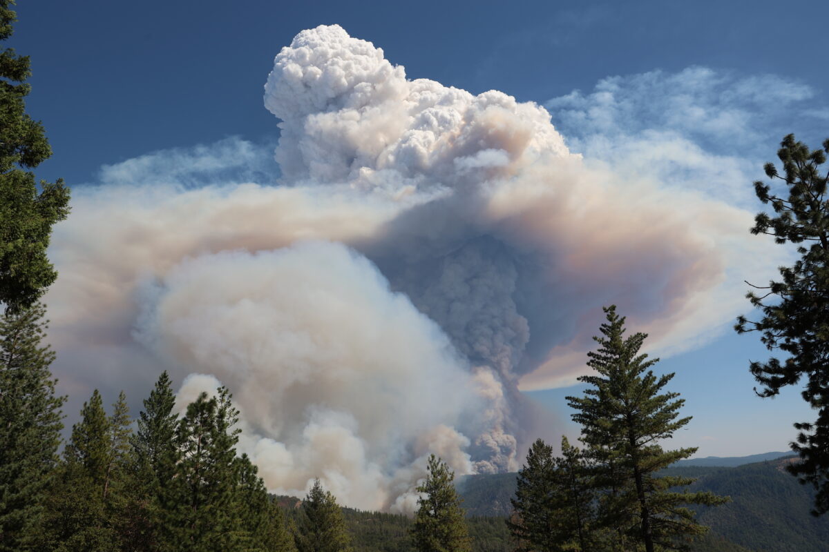 A large cloud of smoke in the sky.