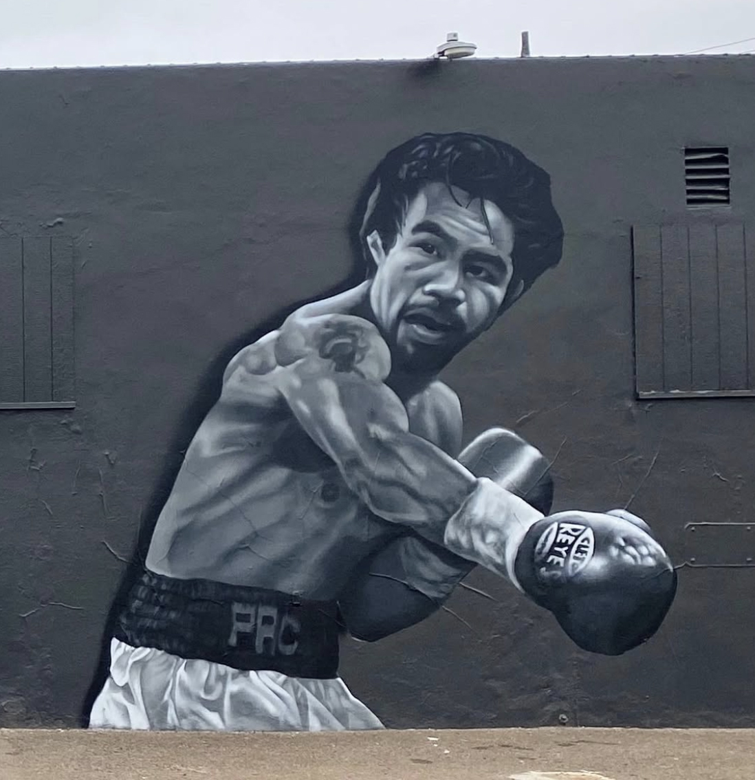 Ground Floor Murals artists Paul Jiménez and Signe Ditona created a mural of Manny Pacquiao for San Diego’s House of Boxing in September 2021. Photo credit: Courtesy Ground Floor Murals/Instagram Total Boxing League