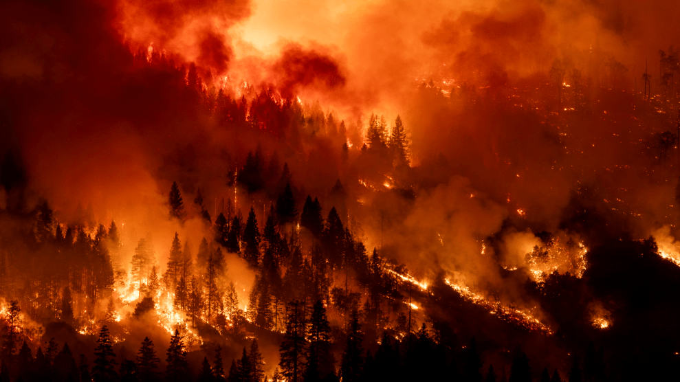 A fire consumes a hillside.