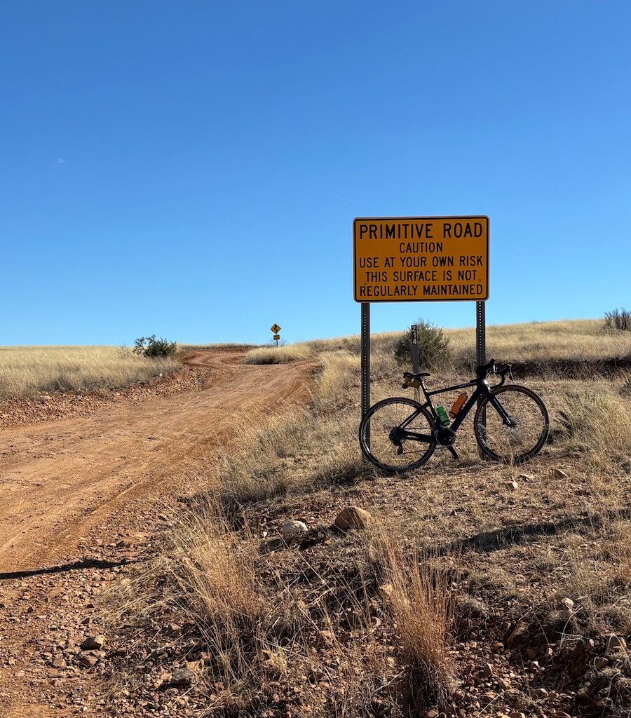 Patagonia road sign with bike on route