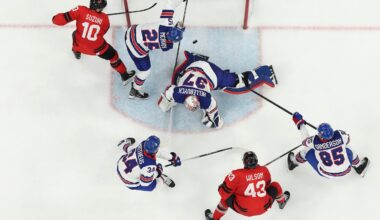 Defenseman Charlie McAvoy (25) and goalie Connor Hellebuyck combined to deny Canada during the third period the the gold-medal game Sunday.
