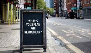 The words "what's your plan for retirement" written on chalkboard on pavement somewhere in London