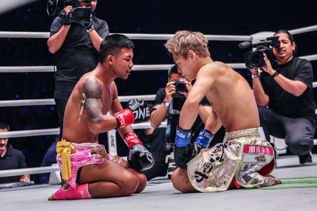 Photographes capture the moment Rodtang consoles Takeu in the ring