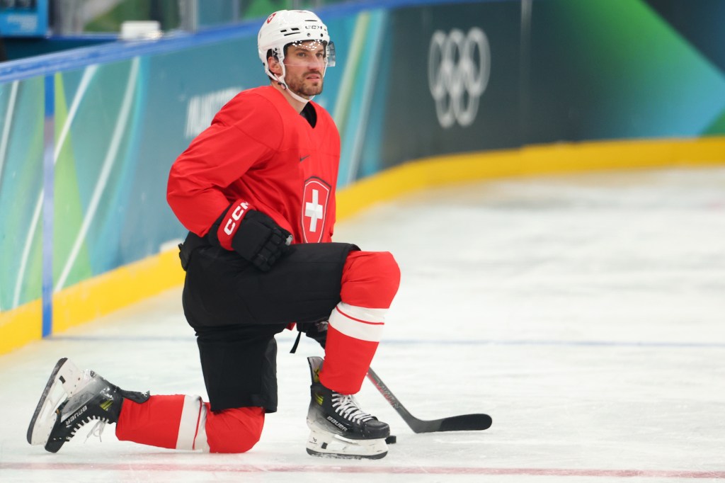 Roman Josi, who plays for the Predators in the NHL, takes a knee during Team Switzerland's practice on Feb. 8, 2026.