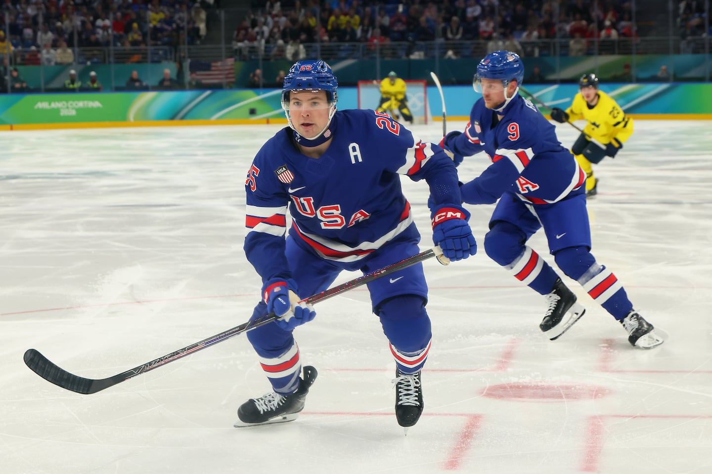 Team USA assistant captain Charlie McAvoy shed the full shield for the Olympic quarterfinal win over Sweden.