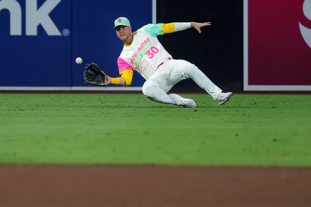 Gavin Sheets #30 of the San Diego Padres makes a catch in the outfield during the sixth inning against the Los Angeles Dodgers at Petco Park on Friday, Aug. 22, 2025 in San Diego, CA. (Meg McLaughlin / The San Diego Union-Tribune)