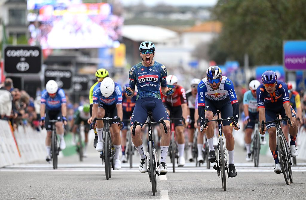 TAVIRA, PORTUGAL - FEBRUARY 18: (L-R) Paul Magnier of France and Team Soudal Quick-Step celebrates at finish line as stage winner ahead of Jordi Meeus of Belgium and Team Red Bull - BORA - hansgrohe and Pavel Bittner of Czech Republic and Team Picnic PostNL during the 52nd Volta ao Algarve em Bicicleta 2026 - Stage 1 a 183.5km stage from Vila Real de Santo Antonio to Tavira on February 18, 2026 in Tavira, Portugal. (Photo by Dario Belingheri/Getty Images)