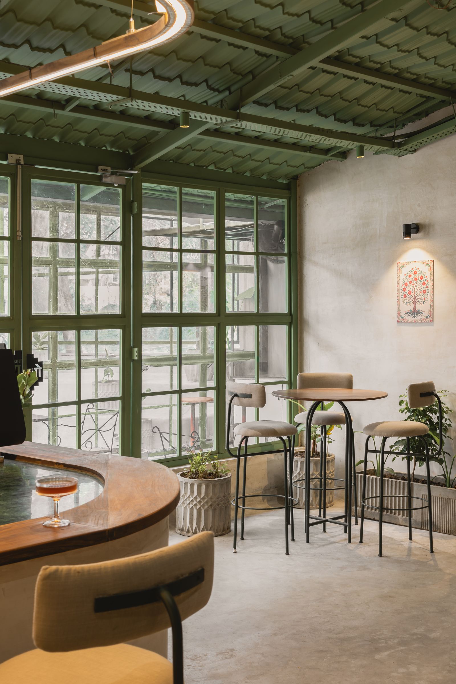 Image may contain Plant Indoors Interior Design Lamp Chair Furniture Table Window Restaurant and Dining Table