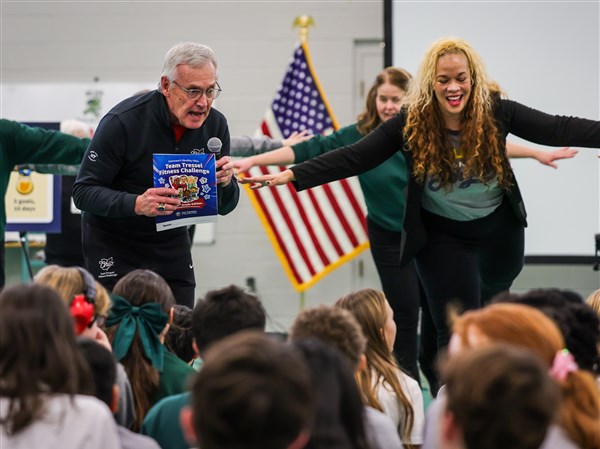Lt. Gov. Jim Tressel exercises with students at Our Lady of Perpetual Help