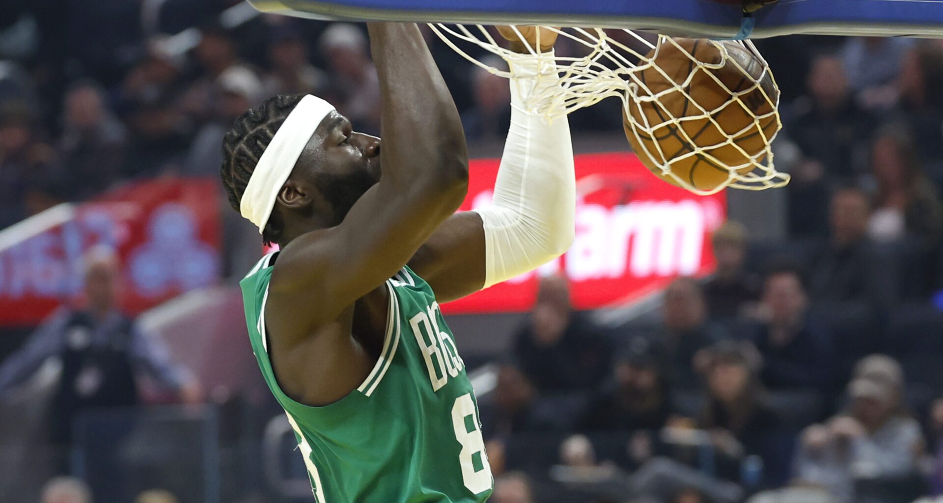 Neemias Queta dunks the ball