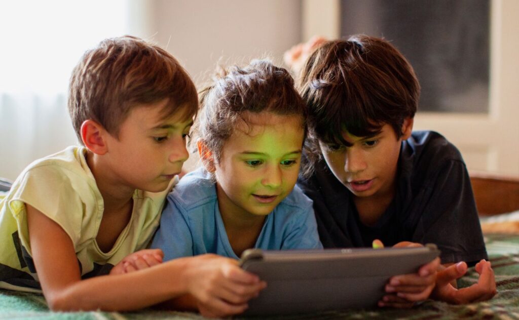 Apple safety features for children: Three children on ipad