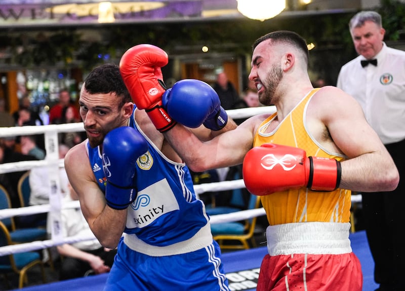 Eoin Vaugh of Ormeau Road and Cypriot Rafael Pafios battle it out at the Balmoral Hotel on Friday night. PICTURE: MARK MARLOW