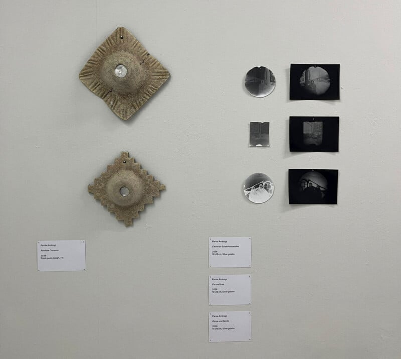 A wall with pictures and signs.